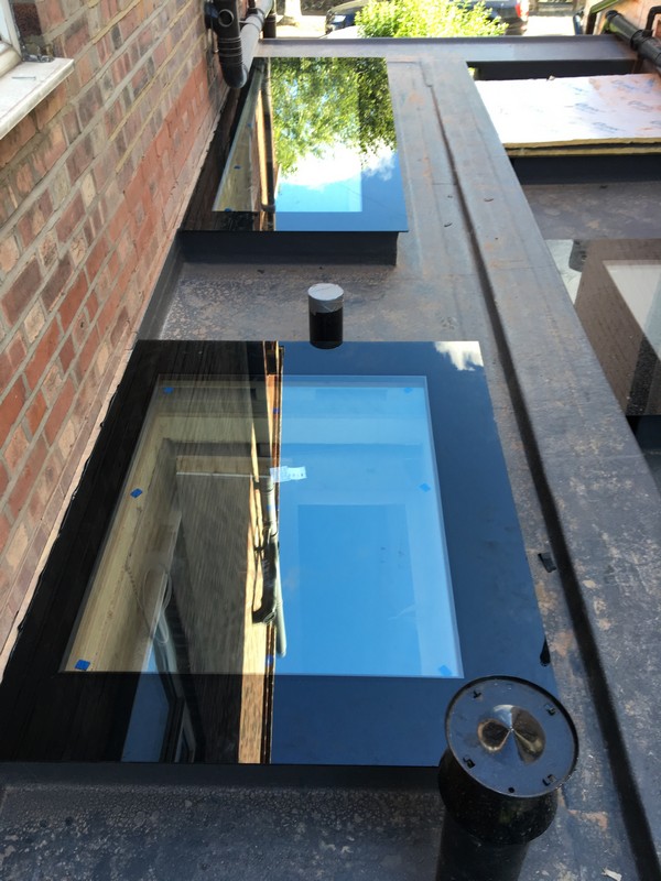 Multiple flat roof skylights on extension in Gerrards Cross